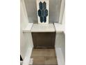 Sample of home interior design material selections showcasing tile, quartz countertop, luxury vinyl flooring and wood cabinet at 371 Chesapeake Cmns St # 116, Garner, NC 27529