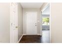 Bright foyer with dark wood floors and a view into the living area, providing a welcoming entrance at 5008 Dantonville Ct, Knightdale, NC 27545