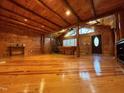 Spacious room with wooden floors, high ceilings, and natural light, creating a warm and inviting atmosphere at 603 Hugo St, Durham, NC 27704