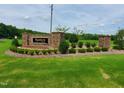 Elegant community sign for Brannon Manor with stone pillars and manicured landscaping at 90 Water Willow Ln, Zebulon, NC 27597