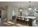 Bright kitchen showcasing a large island with seating, stainless steel appliances, and custom cabinetry at 913 Tyrrell Rd, Raleigh, NC 27609