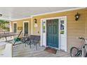 Cozy front porch featuring outdoor seating and decorative elements at 10205 Sorrills Creek Ln, Raleigh, NC 27614