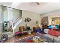 View of the living room area with a staircase and hardwood flooring at 10205 Sorrills Creek Ln, Raleigh, NC 27614