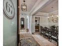 Inviting entryway with archways, wood floors, and views of dining and other living areas at 121 Anfield Rd, New Hill, NC 27562