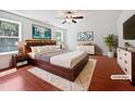 This bedroom boasts a ceiling fan, a warm rug, and is virtually staged to show its potential at 148 Daneborg Rd, Durham, NC 27703