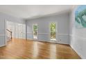 Bright and open living area featuring hardwood floors and a classic, neutral color palette at 2840 Mattlyn Ct, Raleigh, NC 27613