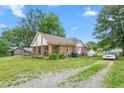 Spacious property featuring a ranch-style home with a covered front porch and driveway at 310 Wood St, Gibsonville, NC 27249