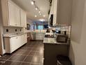 Well-lit kitchen featuring granite countertops, stainless appliances, and modern track lighting at 364 Bayleigh Ct, Garner, NC 27529