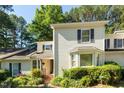 Charming two-story home with a landscaped front yard and inviting entryway at 411 Brampton Close, Pittsboro, NC 27312