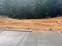 Image shows land being prepped for construction with tree line in the background at 5208 Ranger Grove Way, Raleigh, NC 27604
