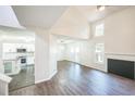 Airy living room featuring vaulted ceilings and new hardwood floors at 5505 Pennfine Dr, Raleigh, NC 27610