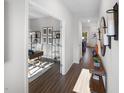 Hallway view to office space featuring dark hardwood floors, and interior decor at 716 Deschutes Dr, Garner, NC 27529