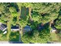 Aerial view of a home with a large, tree-filled lot in a serene, wooded neighborhood setting at 1012 Bermuda Run, Knightdale, NC 27545