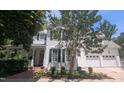 Charming two-story home with black shutters, well-maintained landscaping and a two car garage at 104 Edgewater Cir, Chapel Hill, NC 27516