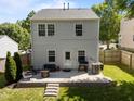 Open backyard with a patio including furniture, barbecue grill, and a small retaining wall at 109 Gladstone Dr, Durham, NC 27703