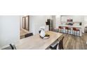 Open-concept dining area featuring a large table and chairs, seamlessly connected to the kitchen at 1412 Maple Branch Cir # 35, Graham, NC 27253