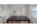Bright office featuring hardwood floors, natural light, and a modern minimalist desk at 260 Pretty Run Branch Ln, Wendell, NC 27591
