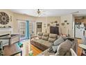 Spacious living room with hardwood floors, fireplace and direct access to the outside at 320 Madres Ln, Morrisville, NC 27560