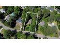 Heavily treed lot with a home that is secluded from the surrounding neighborhood at 3422 Redbud Ln, Raleigh, NC 27607