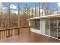 Relaxing back deck with screened in porch, perfect for enjoying the outdoors at 4009 Olde Coach Rd, Durham, NC 27707