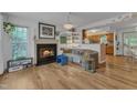 Inviting living room features a cozy fireplace and seamless access to the kitchen at 4009 Olde Coach Rd, Durham, NC 27707