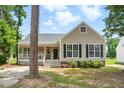 Charming single-Gathering home with inviting front porch and manicured lawn at 4905 Knightsbridge Way, Raleigh, NC 27604