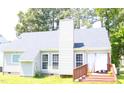 Back exterior view of home showcasing a deck area perfect for entertaining at 4905 Knightsbridge Way, Raleigh, NC 27604