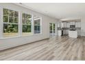 Bright and airy living room with wood floors, complemented by an open layout at 516 Winding Creek Dr, Lillington, NC 27546