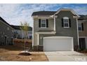 Charming two-story home with a two-car garage and appealing exterior color scheme at 526 Catalina Grande Dr, Cary, NC 27519