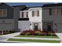 Beautifully landscaped townhome with a charming exterior at 1035 Winding Spring Dr, Mebane, NC 27302
