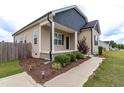 Beautiful exterior with landscaping, cozy front porch, and manicured greenery at 1071 Turlington Rd, Dunn, NC 28334