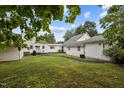 Expansive backyard featuring lush greenery and mature trees at 1146 Rogers Rd, Graham, NC 27253