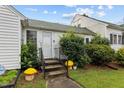 Inviting front porch with decorative plants and charming details at 1146 Rogers Rd, Graham, NC 27253
