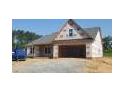 Charming exterior elevation of a new home with a two-car garage and a gable roof design at 123 Maple Dr, Erwin, NC 28339