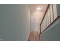 Entryway staircase with wooden handrail, leading to the upper level at 151 Braeside Ct, Cary, NC 27519