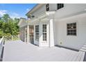 Spacious deck area adjacent to a screened porch, perfect for outdoor entertaining at 1605 Baneberry Ct, Willow Springs, NC 27592