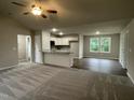 Bright living area flowing into the modern kitchen, featuring sleek countertops at 170 Starry Sky Dr, Benson, NC 27504