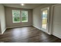 Sunroom featuring wood-look flooring, and lots of natural light at 170 Starry Sky Dr, Benson, NC 27504