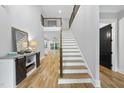 Elegant foyer showcases hardwood floors, a staircase with iron balusters, and an open layout at 2040 Pleasant Forest Way, Wake Forest, NC 27587
