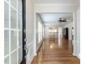View of the foyer featuring hardwood floors, white walls, and a dining area and Gathering room at 207 Callum Pl, Cary, NC 27519
