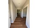 Inviting entryway with beautiful wood floors and a view into the spacious living area at 217 Busterfield Ct, Benson, NC 27504