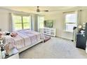 Bright main bedroom with plenty of natural light, carpet floors, and neutral decor at 2511 Kestrel Heights Ct Ct, Durham, NC 27703