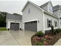 Attached two-car garage and detached one car garage with a spacious driveway at 268 Busterfield Ct, Benson, NC 27504