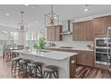 Stylish kitchen features a large island, stainless steel appliances, and pendant lighting, perfect for modern living at 2915 Winter Crop Way, Apex, NC 27502