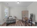 Cozy home office with a comfortable chaise lounge and sleek desk setup at 2915 Winter Crop Way, Apex, NC 27502