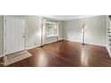 Inviting living room with hardwood floors, bright windows, and neutral walls at 310 Bay Dr, Cary, NC 27511