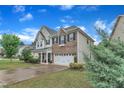 Well-maintained two-story home features an attached garage, landscaped yard, and classic design at 3449 S Beaver Ln, Raleigh, NC 27604