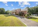 View of brick home with charming covered entrance and meticulously kept yard at 4024 Rural Retreat Rd, Burlington, NC 27215