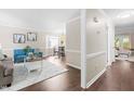 Spacious living room boasts hardwood floors, neutral paint, and an open layout perfect for entertaining guests at 6104 New Market Way, Raleigh, NC 27609