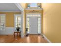 Bright foyer with hardwood floors, high ceilings, transom windows, and natural light at 1420 Norwood Crest Ct, Raleigh, NC 27614
